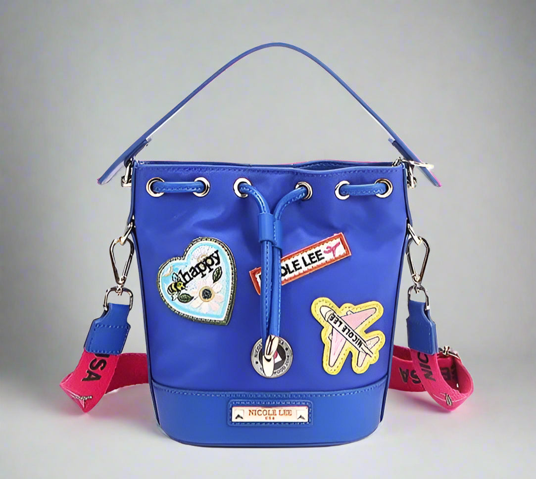 Blue bucket bag with colorful patches and drawstrings on a white background