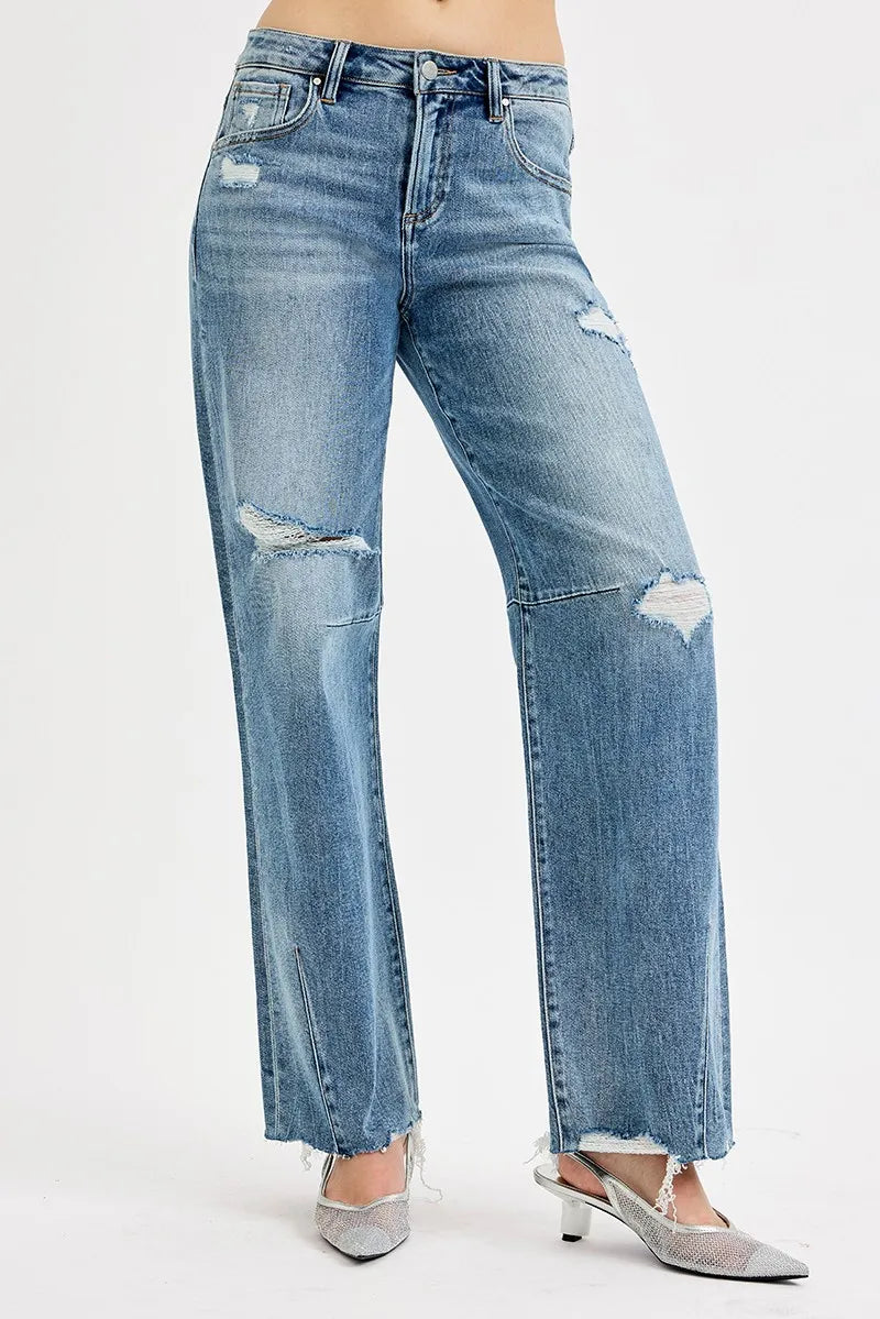 Distressed blue jeans on a white background