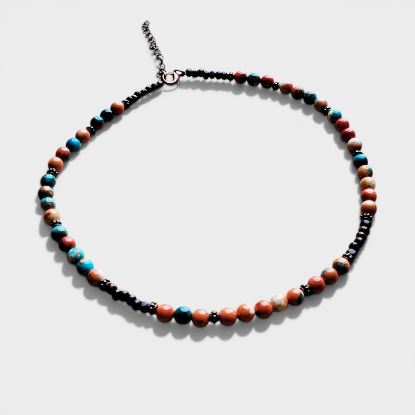Necklace with multicolored beads on a white background