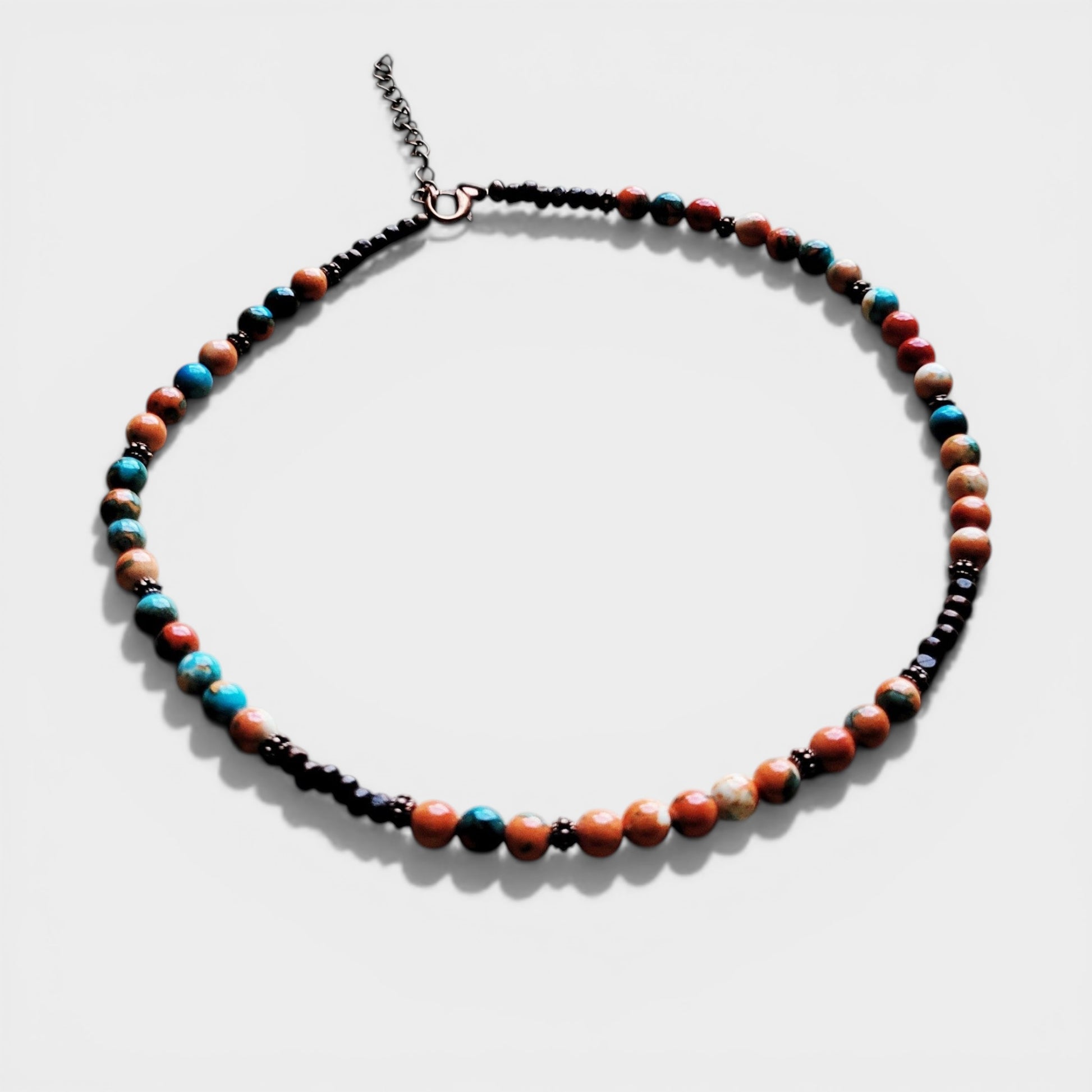 Necklace with multicolored beads on a white background