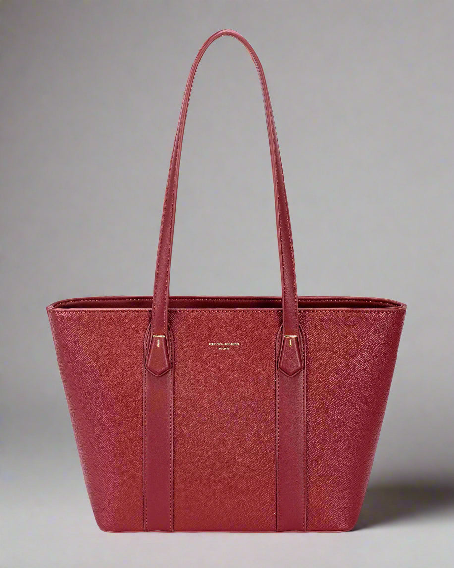 Red handbag with a visible brand logo on a light gray background