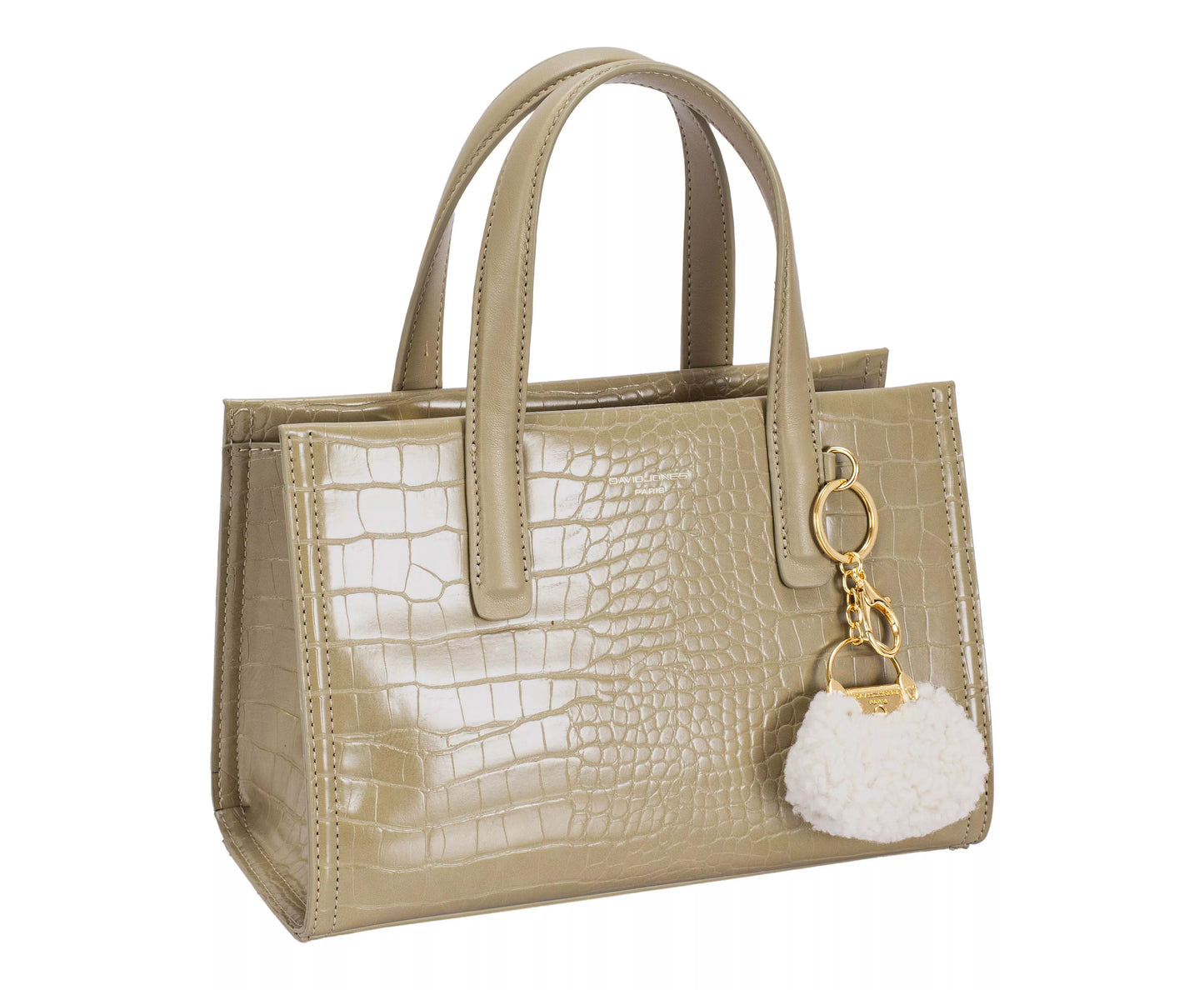 Beige handbag with a textured pattern and a matching keychain on a white background