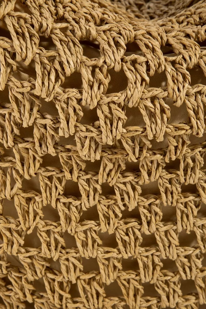 Close-up of a textured brown fabric with a woven pattern