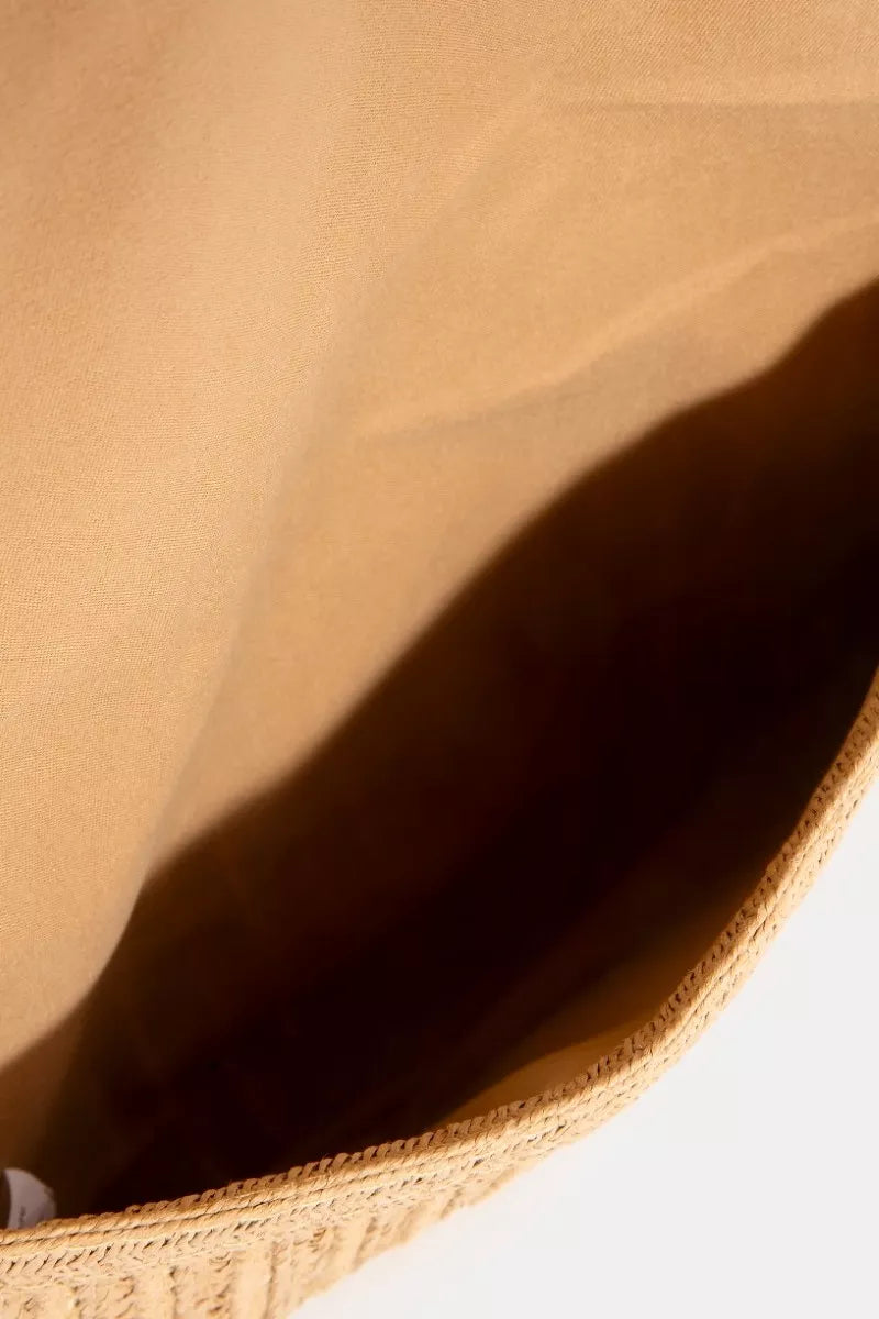 Close-up of a textured beige fabric surface