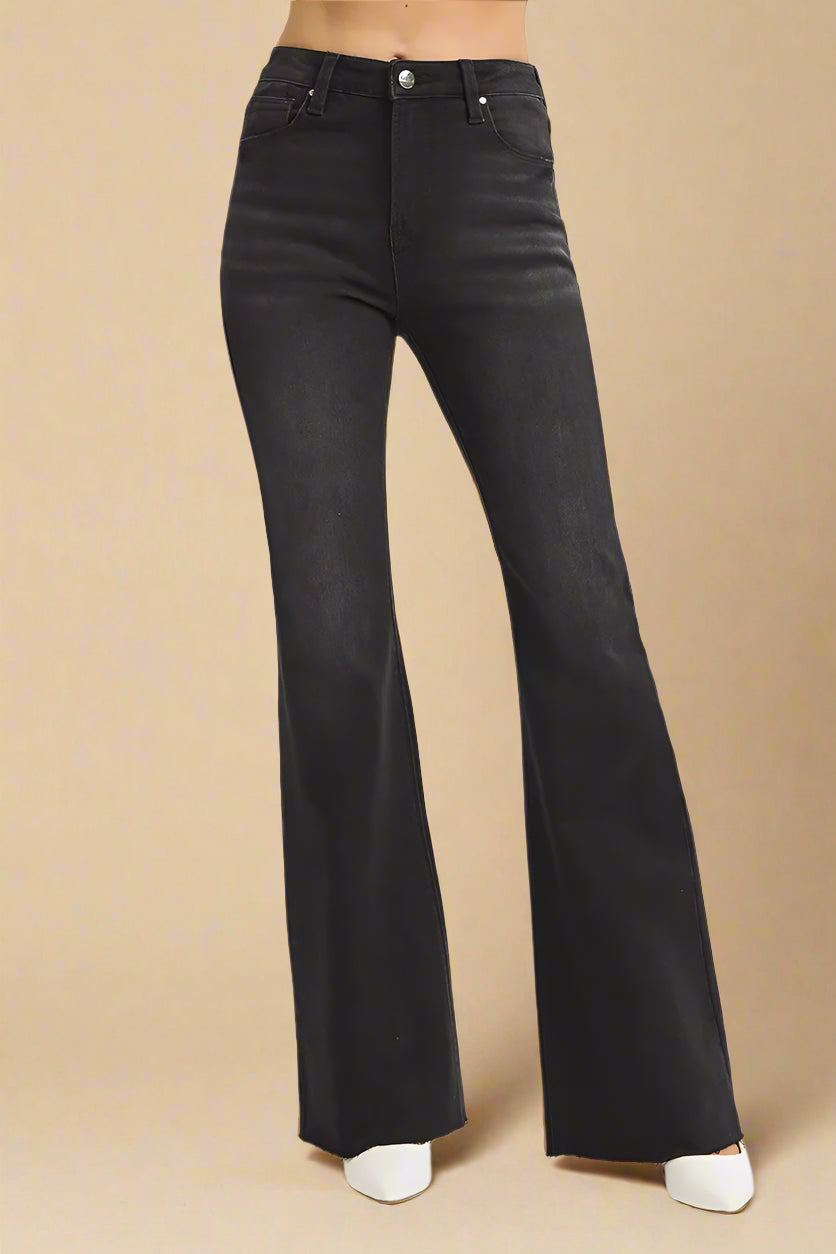 Black flared jeans on a white background