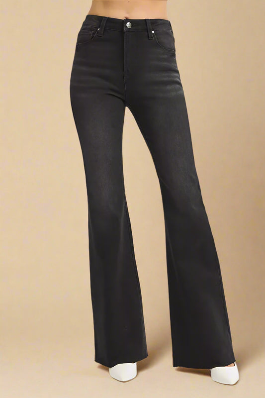 Black flared jeans on a white background