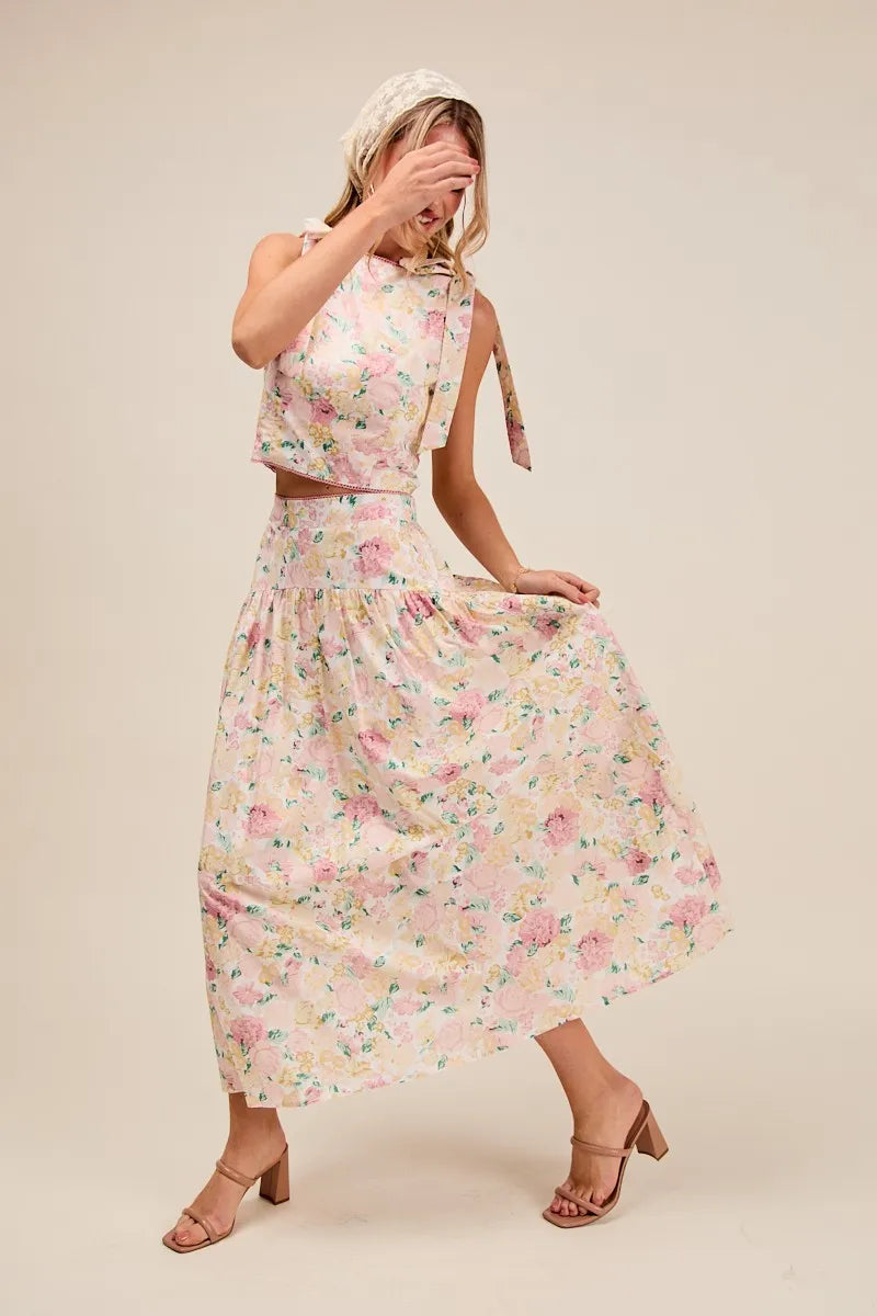 Woman wearing a floral dress on a beige background