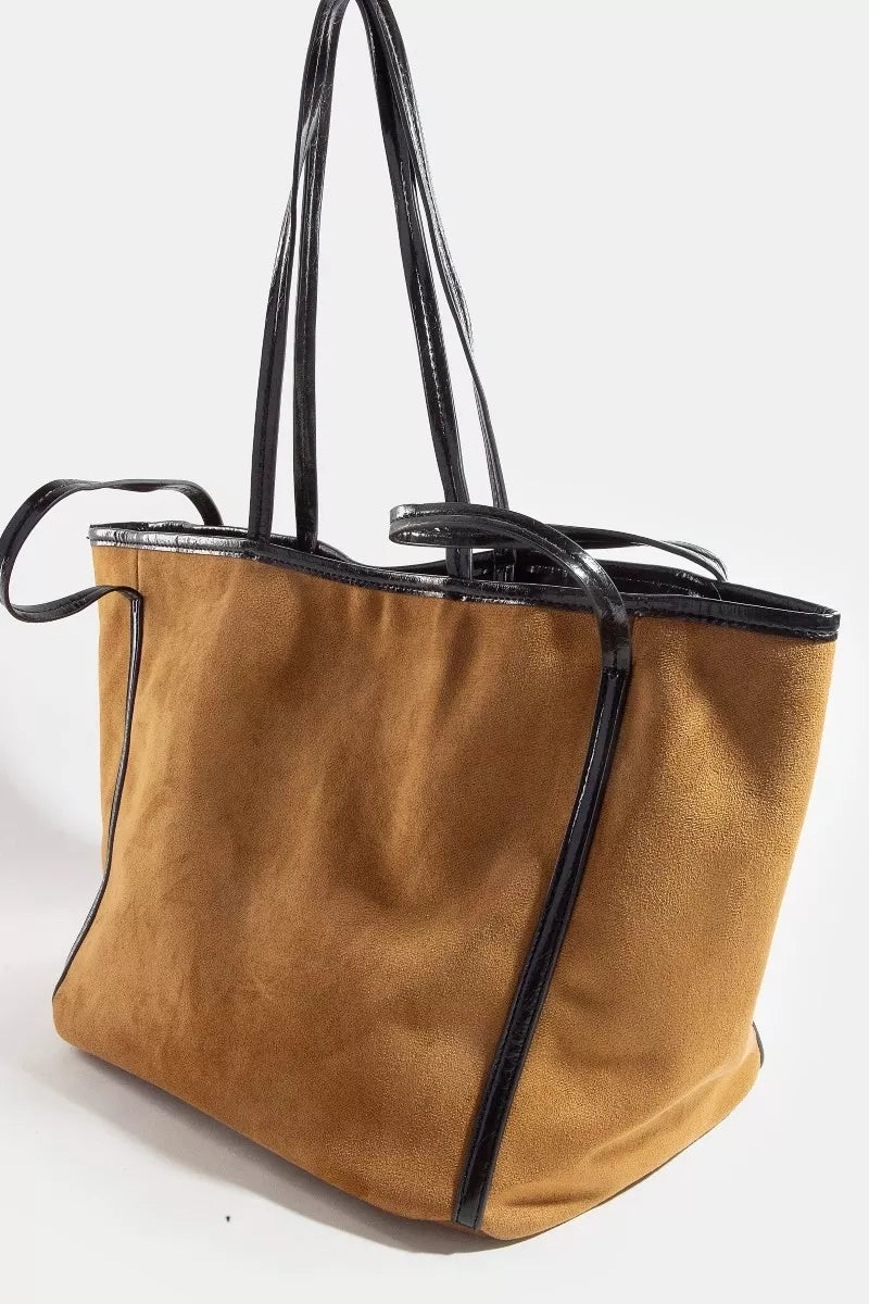 Brown tote bag with black accents on a white background