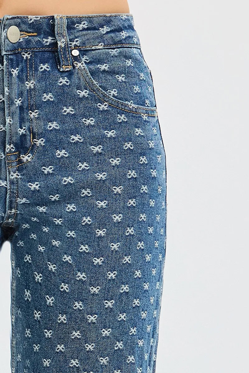 Blue jeans with white bow pattern on a white background