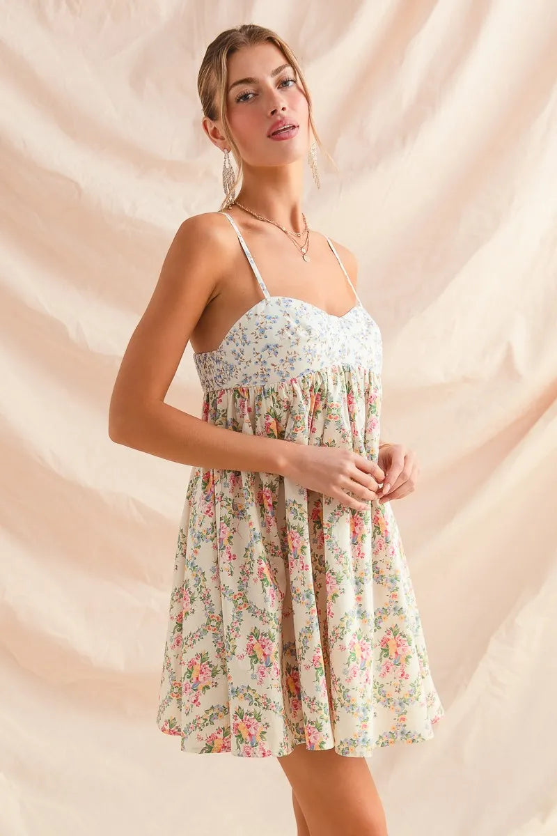Woman wearing a floral dress against a beige background