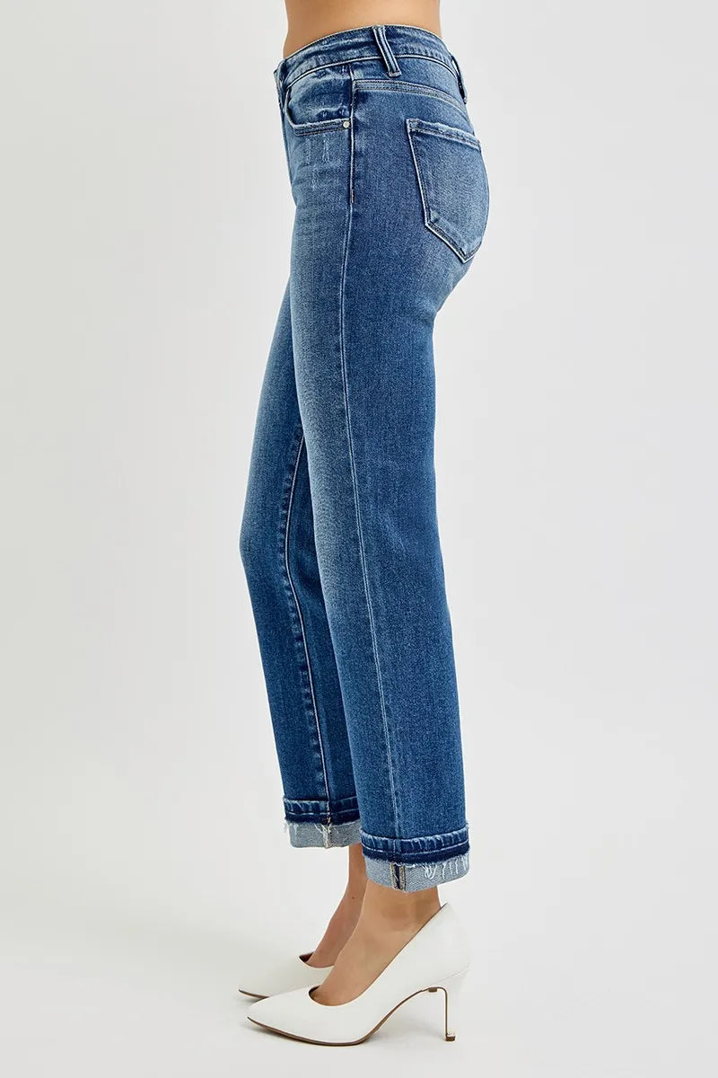 Blue jeans worn by a person on a white background