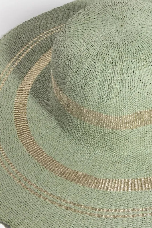 Green straw hat with gold trim on a white background