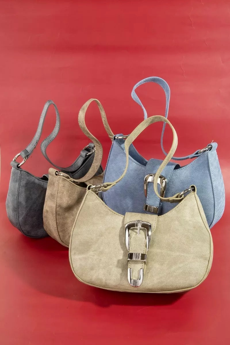 Four handbags in different colors arranged on a red background