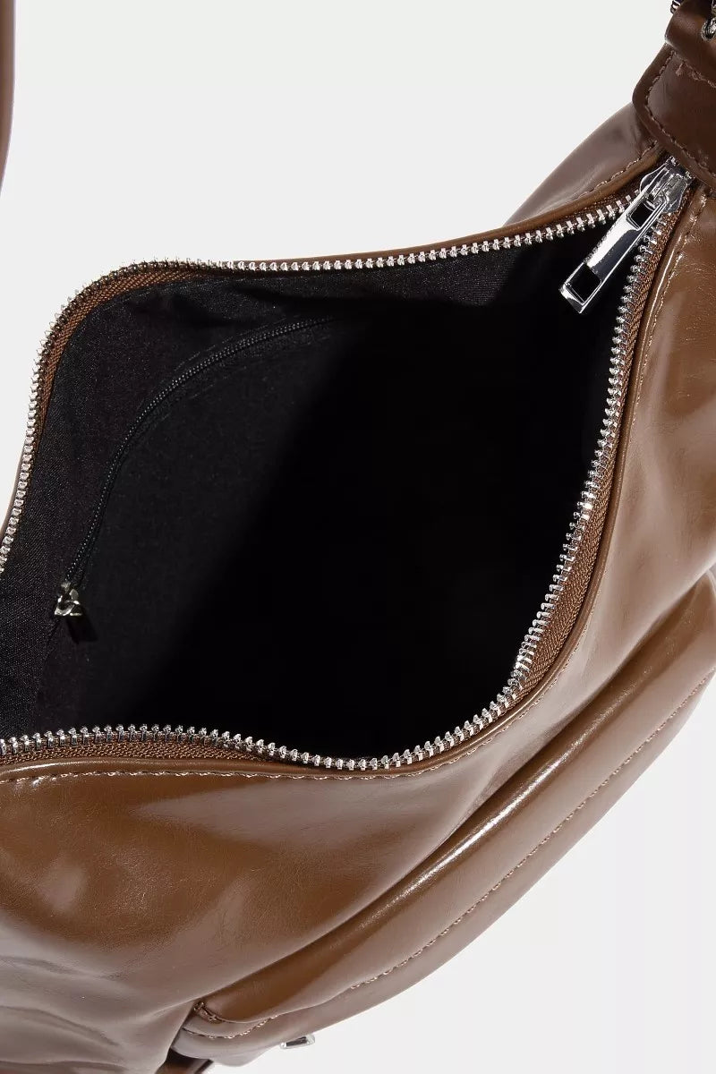 Brown leather bag with a zipper on a white background