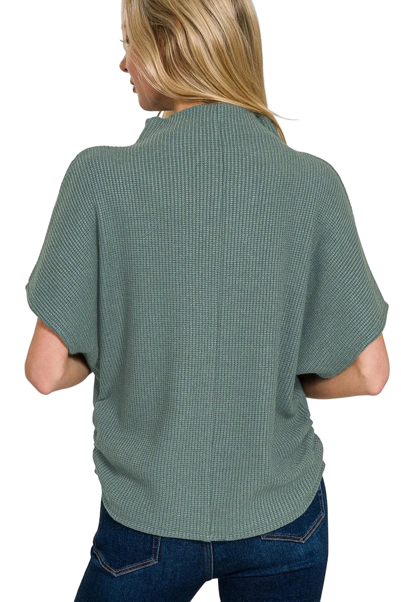 Person wearing a green textured shirt on a white background