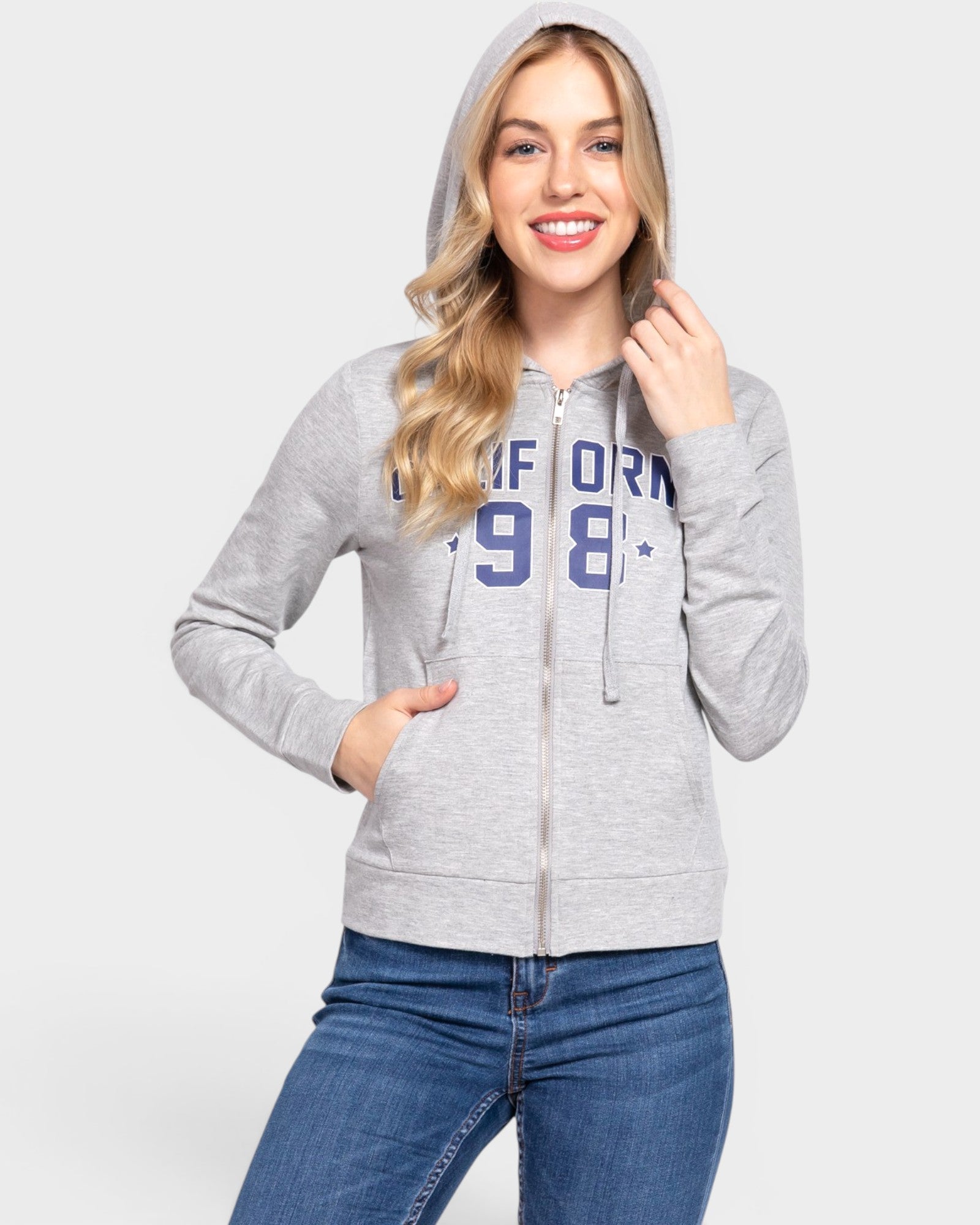 Woman wearing a gray hoodie with 'California 98' text on a white background