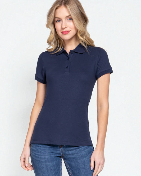 Woman wearing a navy blue polo shirt against a white background
