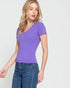 Woman wearing a purple t-shirt with a pocket on a white background