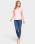 Woman wearing a pink top and blue jeans on a white background