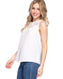 Woman wearing a white sleeveless top with lace details on a white background