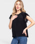 Woman wearing a black top with lace details on a white background
