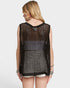 Woman wearing a black crochet sleeveless top on a white background