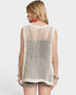 Woman wearing a beige crochet top on a white background