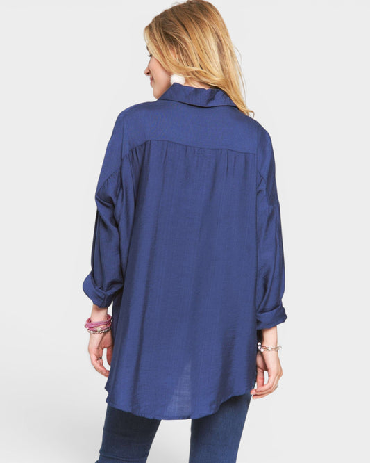 Woman wearing a blue shirt on a white background