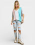 Woman wearing a colorful outfit with a white background