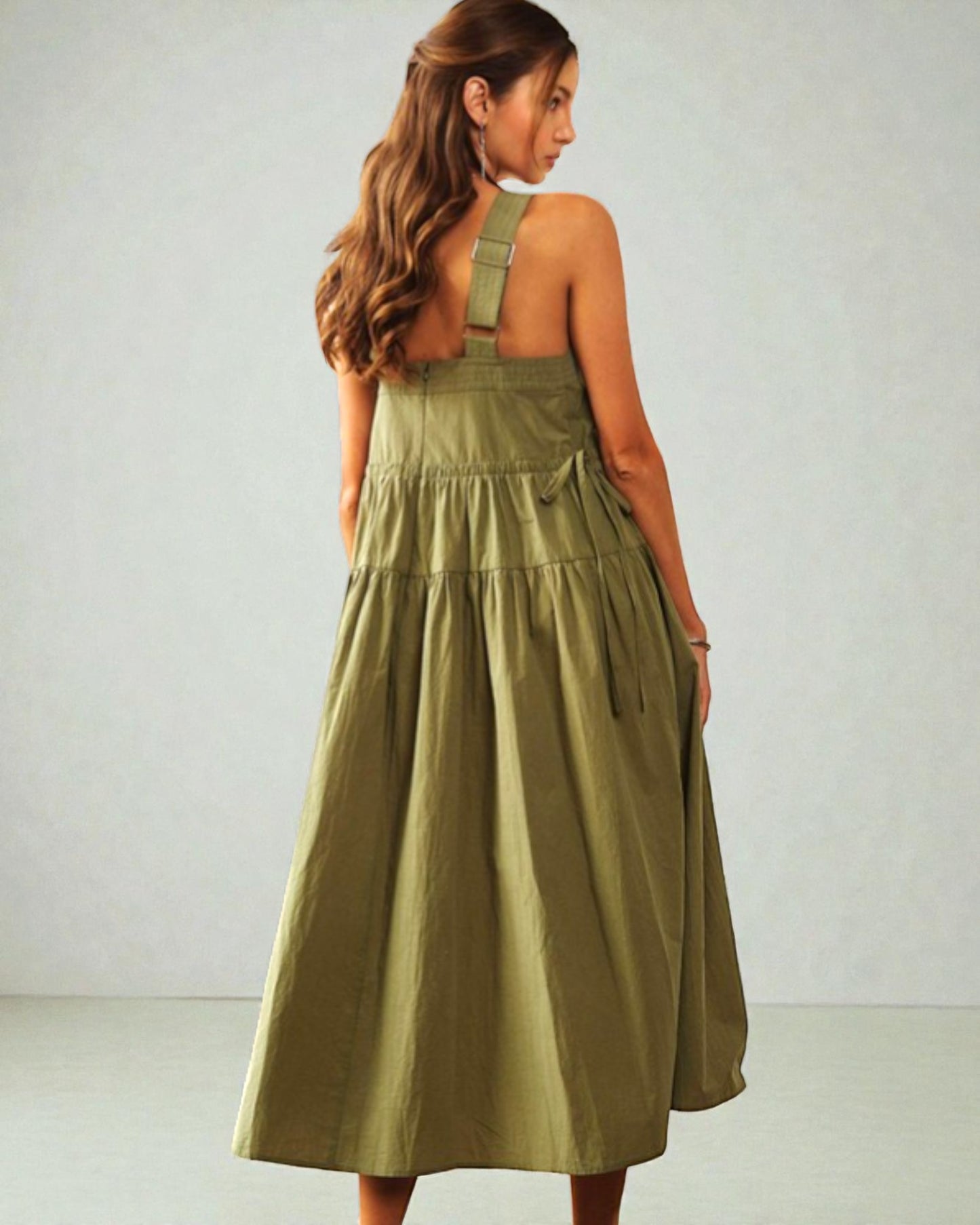 Woman wearing a green dress against a white background