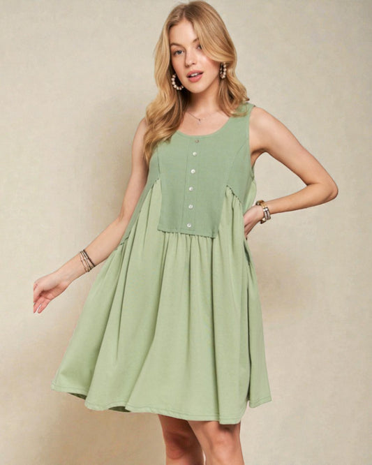 Woman wearing a green dress against a beige background