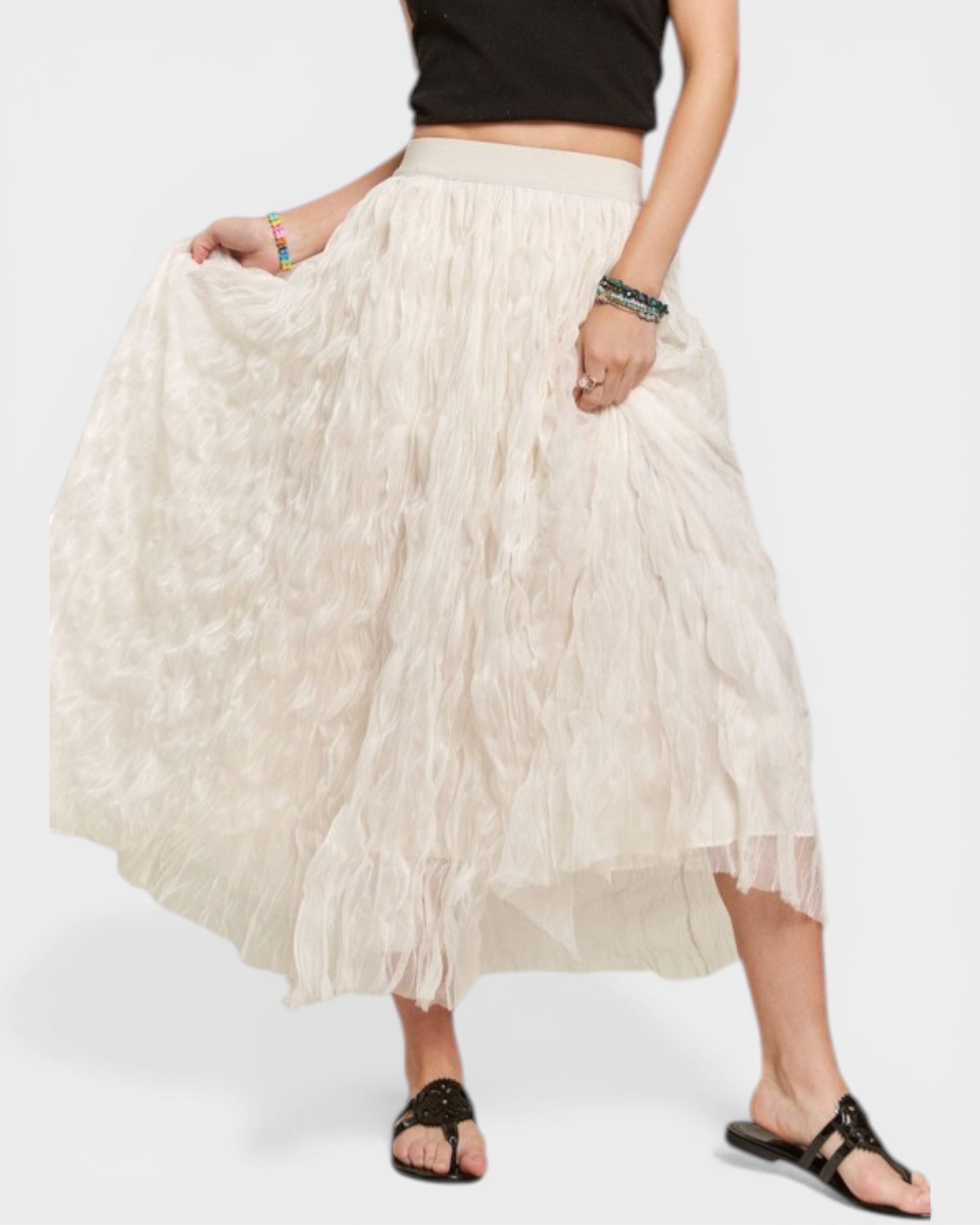 Person wearing a beige skirt on a white background