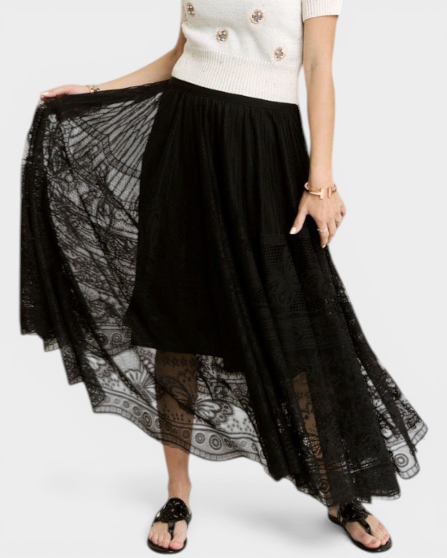 Black lace skirt with a white top on a white background