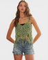 Woman wearing a green crochet tank top with fringes on a white background