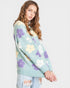 Woman wearing a light blue sweater with floral patterns on a white background