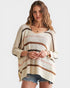 Woman wearing a striped sweater with a plain background