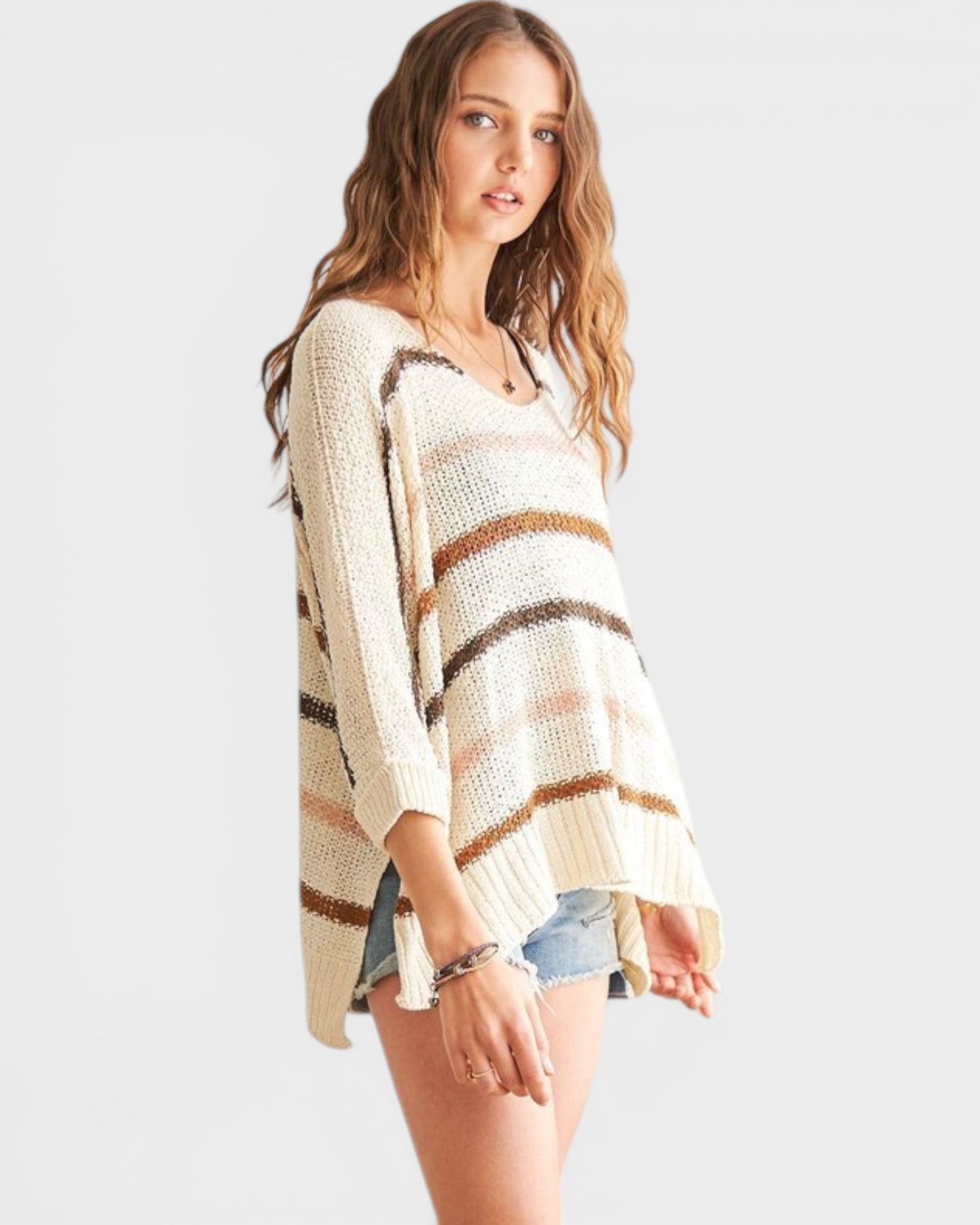 Woman wearing a striped sweater on a white background