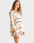 Woman wearing a striped sweater on a white background