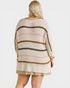 Woman wearing a striped sweater with a plain background