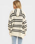 Person wearing a striped hoodie with a plain background