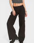 Person wearing black wide-leg pants on a white background