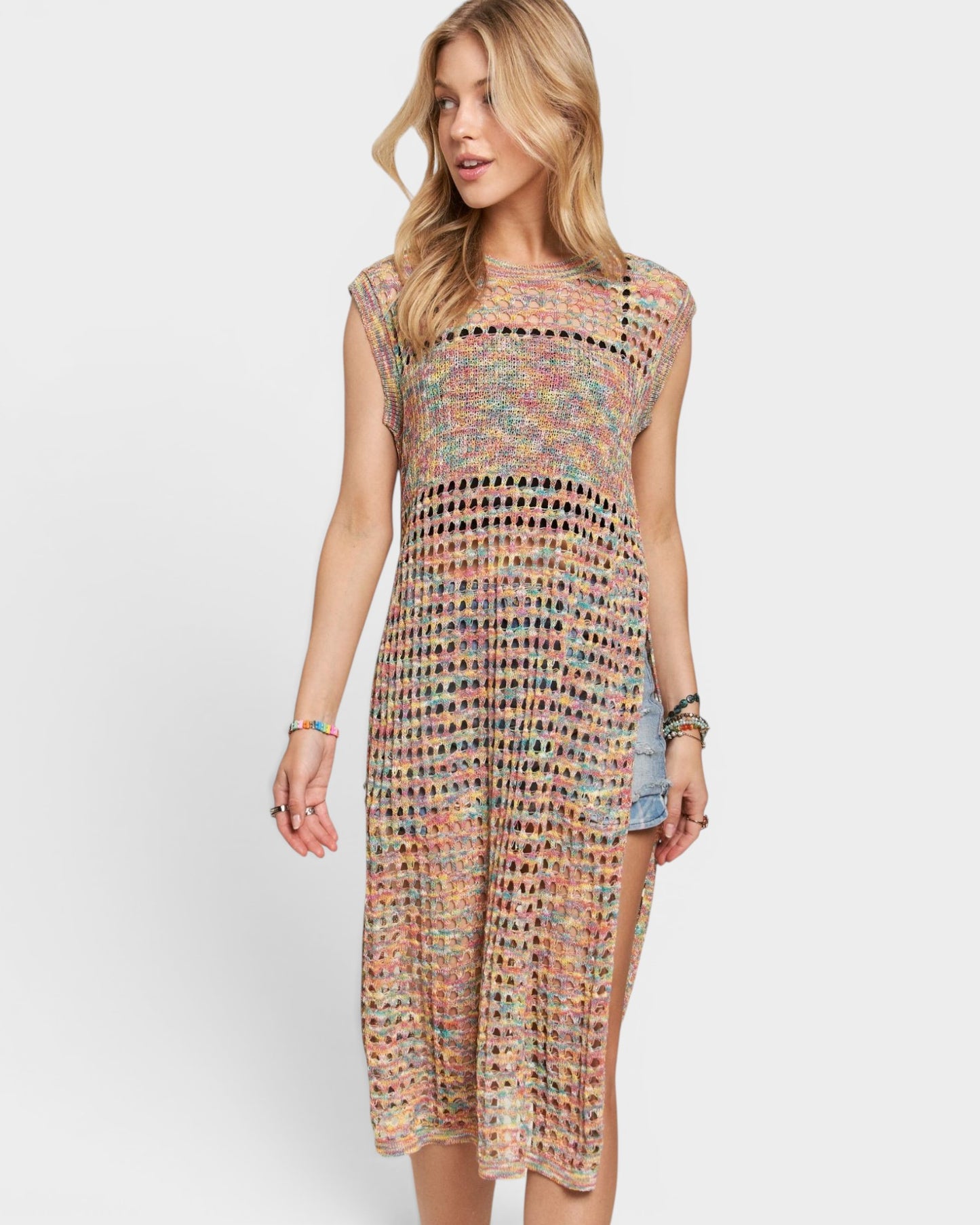 Woman wearing a colorful patterned dress on a white background