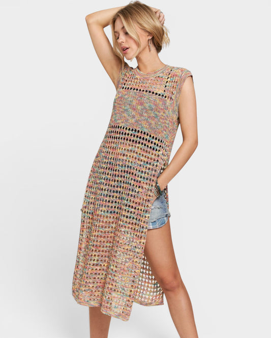 Woman wearing a patterned sleeveless dress on a white background