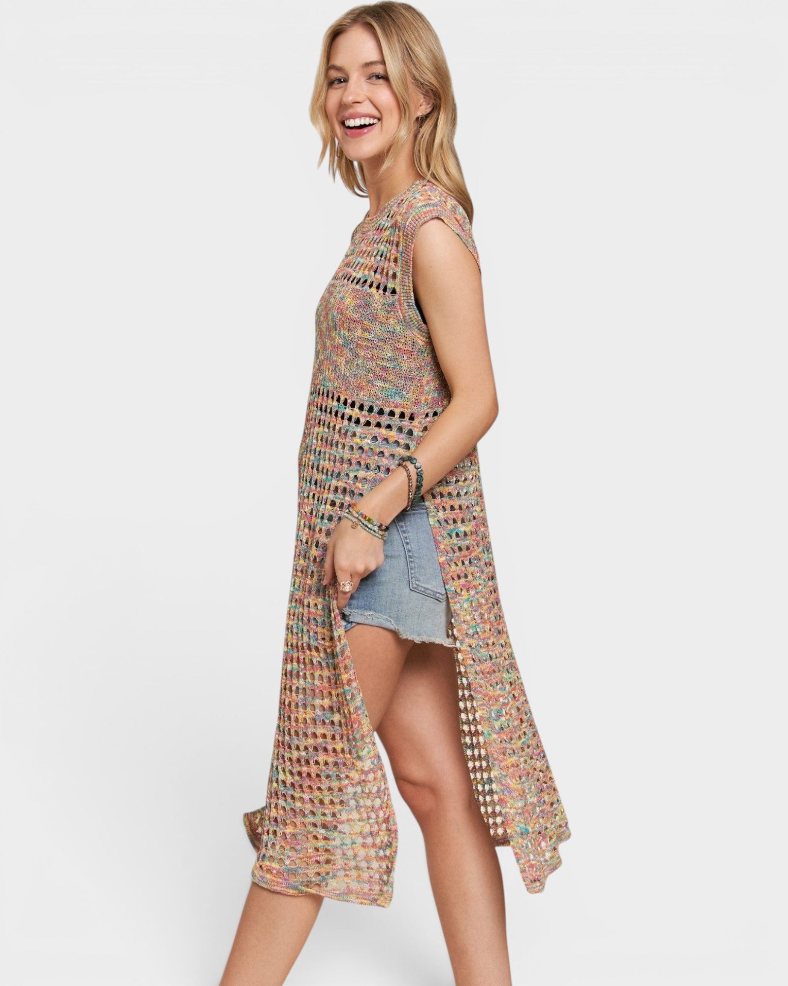 Woman wearing a colorful patterned dress on a white background
