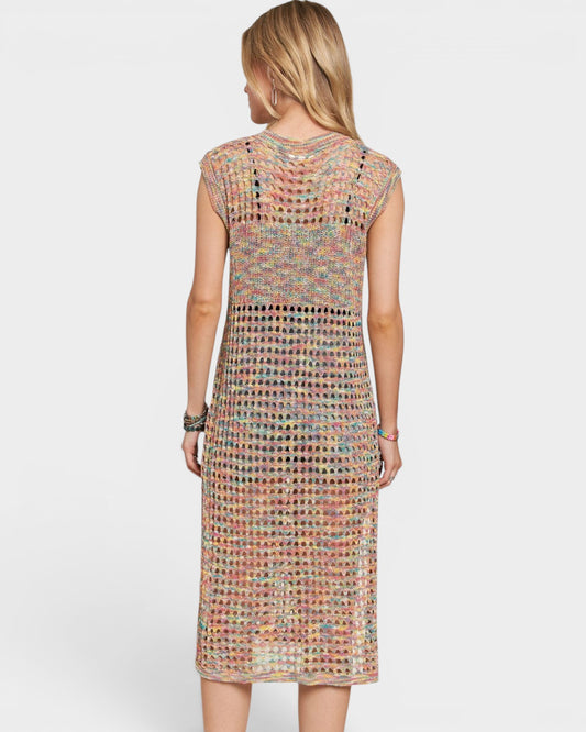 Woman wearing a colorful patterned dress on a white background