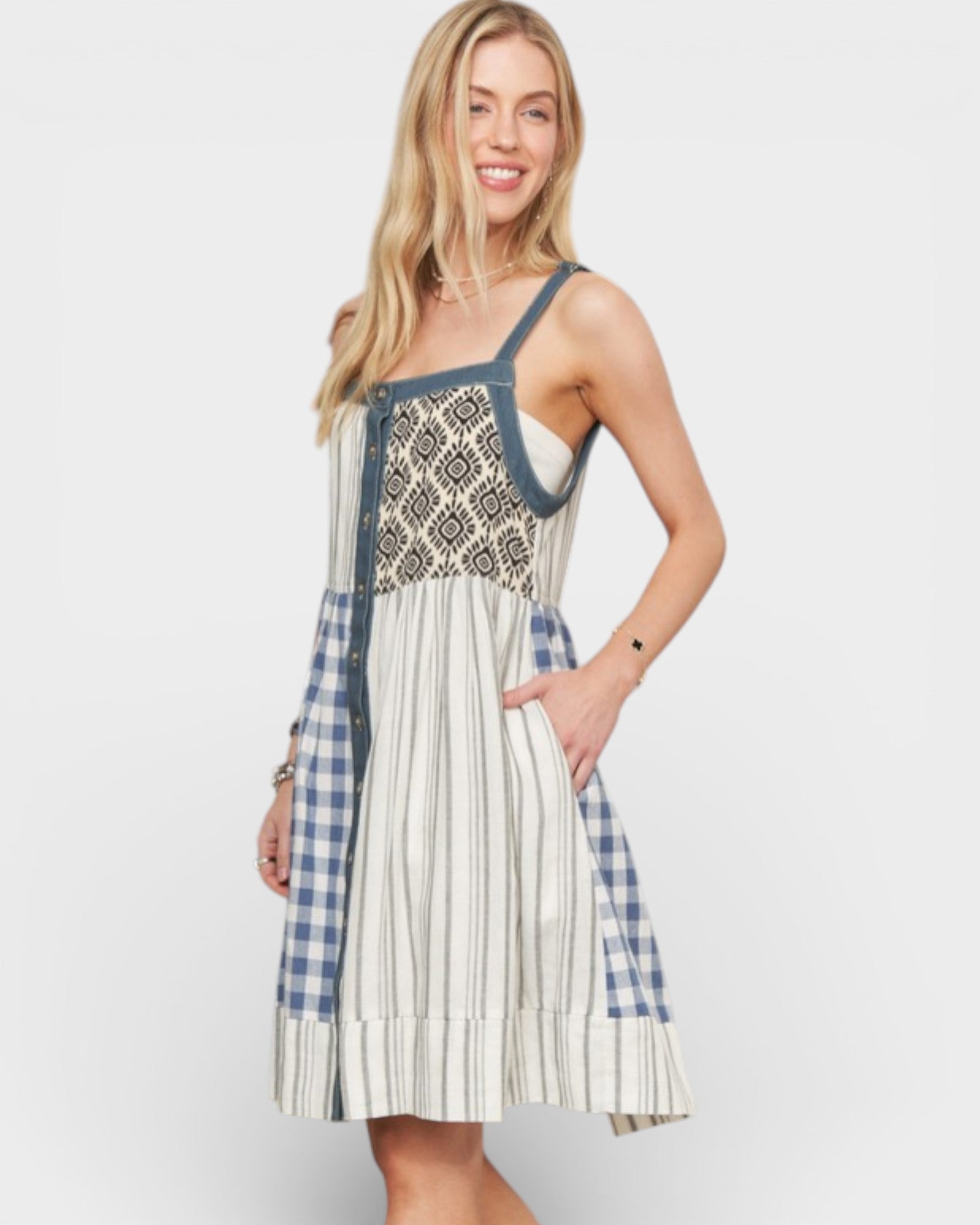 Woman wearing a patterned dress with a white background