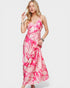 Woman wearing a pink floral dress on a white background