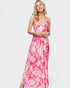 Woman wearing a pink floral dress on a white background