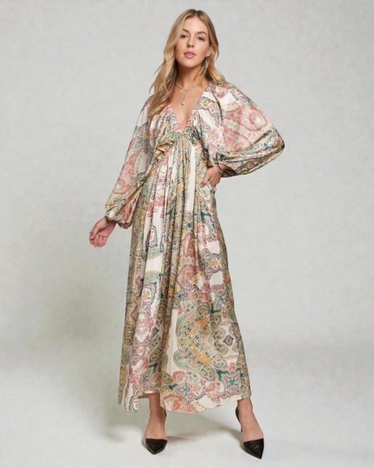 Woman wearing a floral dress on a plain background