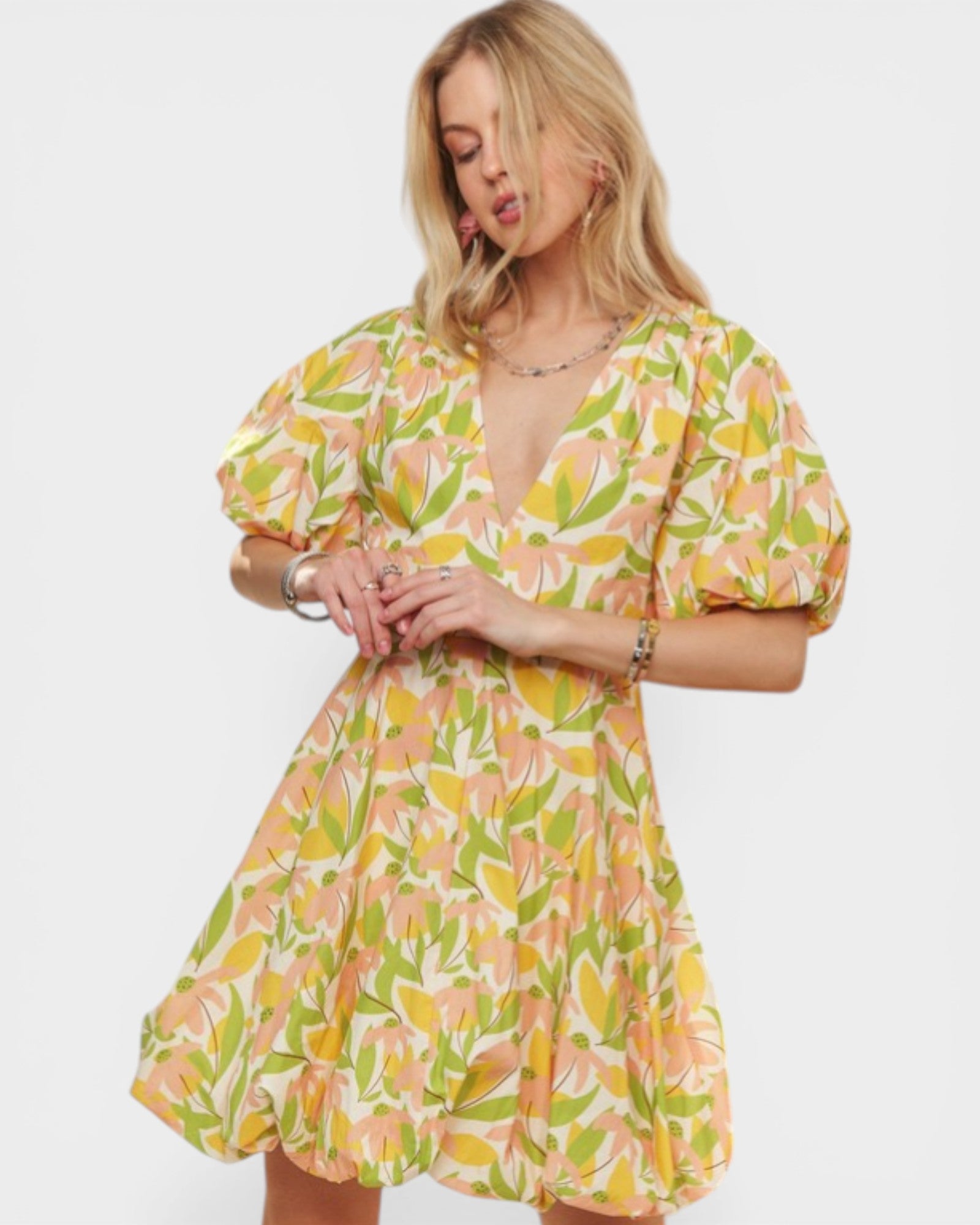 Woman wearing a floral dress on a white background